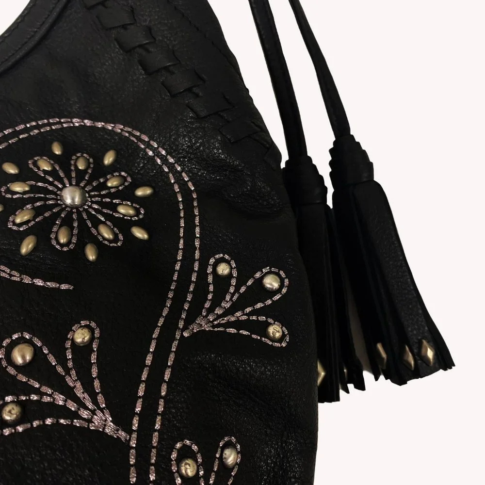 Fiore by Isabella Fiore Black Leather Studded Floral Hobo Bag Whipstitch Tassel